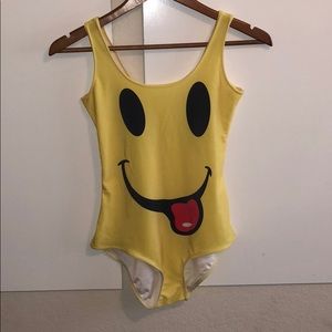 Yellow smiley face bodysuit